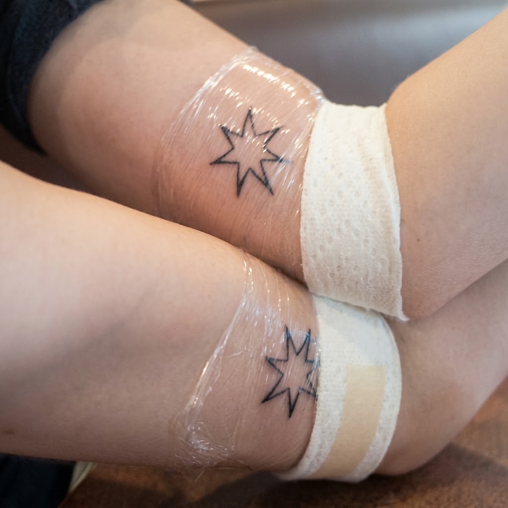 Emilie and Rachel's matching star tattoos, 2010